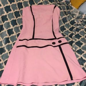 a light pink strapless dress with black detailing